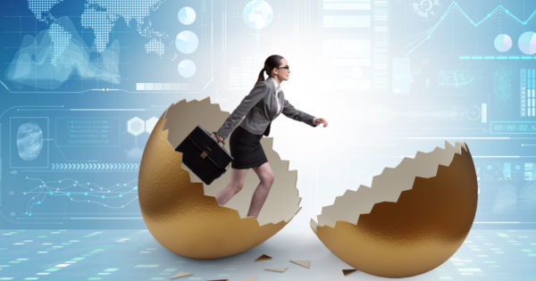 high performing sales account managers (female executive hatching from an egg)